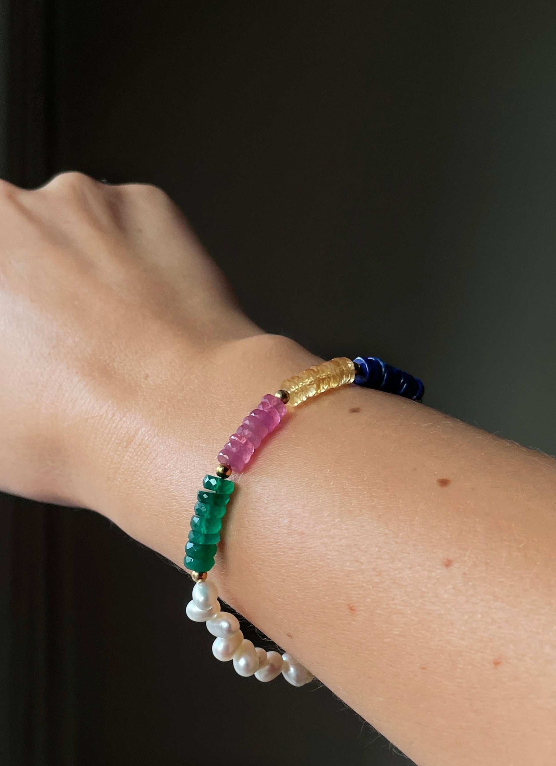 monái asymmetric rainbow bracelet styled on wrist – bold, modern jewelry for self-expression through color