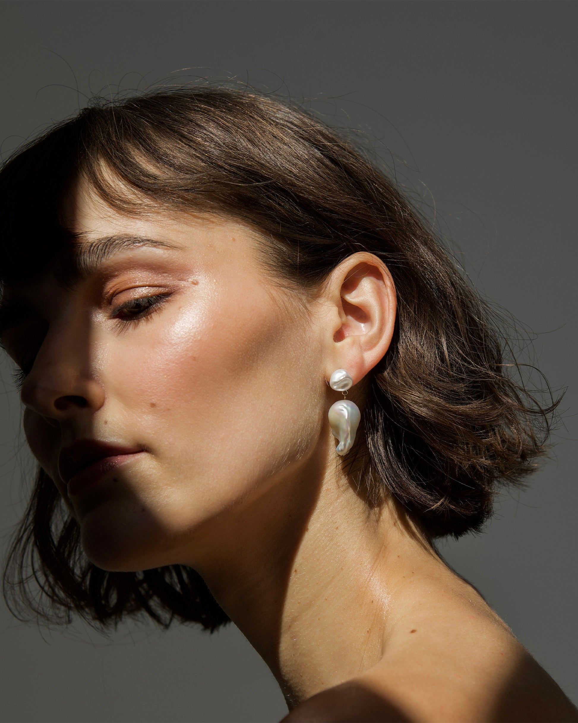 Bare Baroque Pearl Earrings styled on model – understated statement jewelry that highlights imperfection and individuality by monái