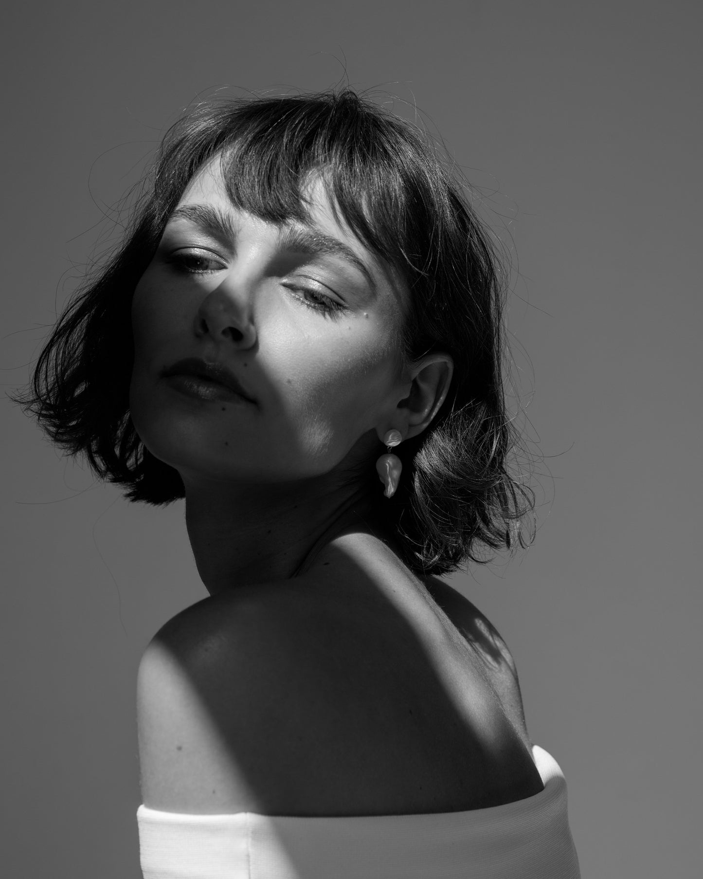 Bare Baroque Pearl Earrings styled on model – understated statement jewelry that highlights imperfection and individuality by monái