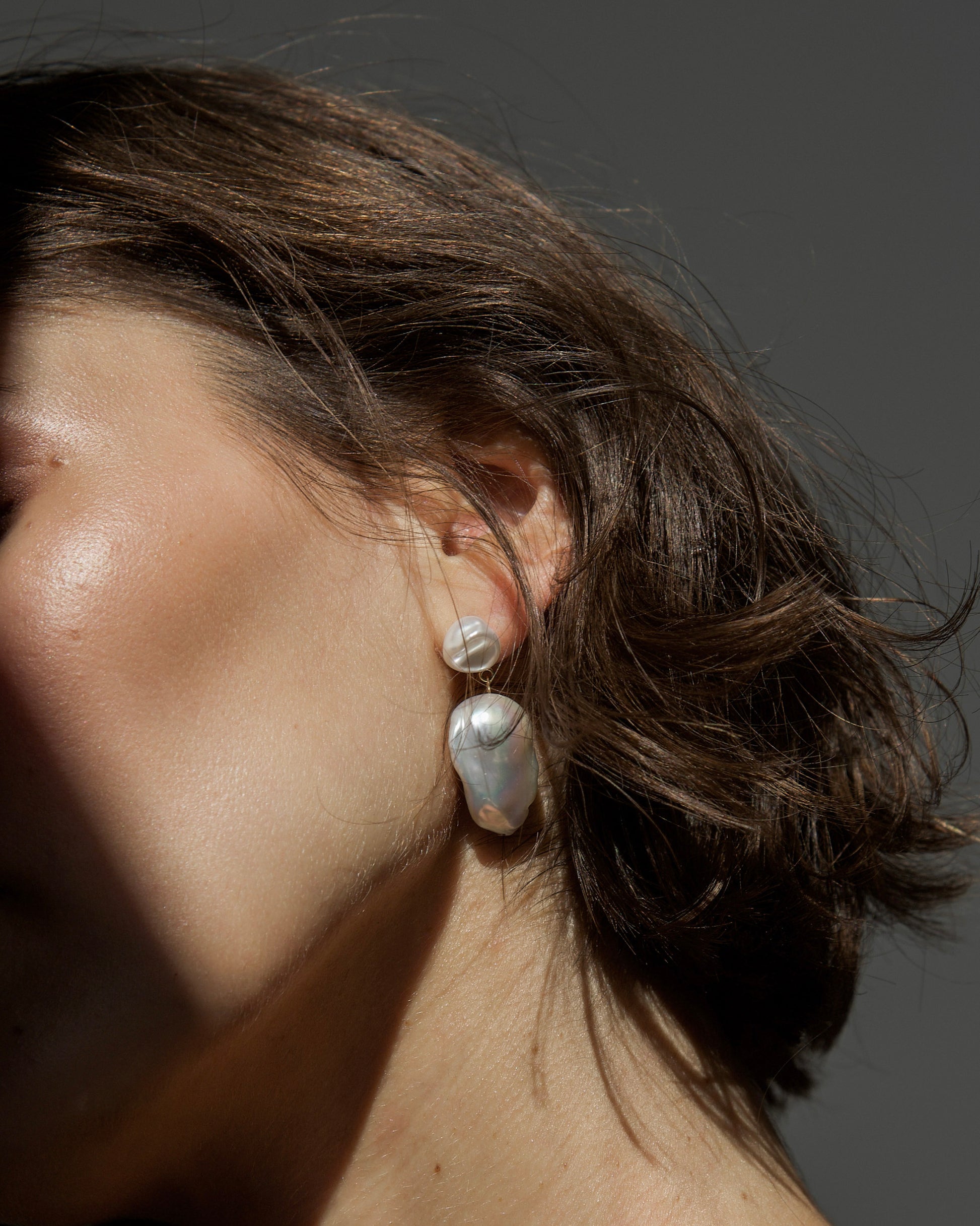 Bare Baroque Pearl Earrings styled on model – understated statement jewelry that highlights imperfection and individuality by monái