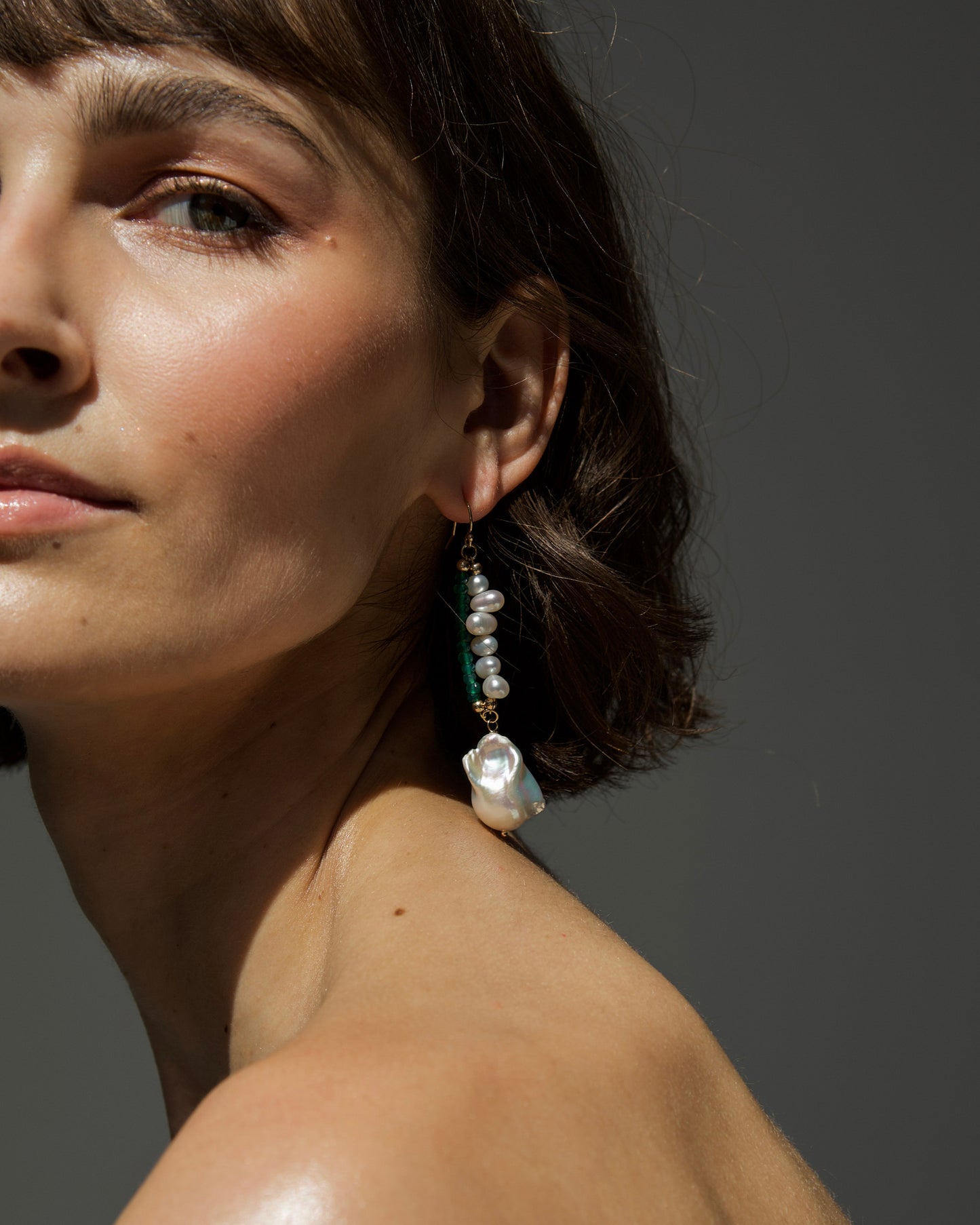 monái baroque pearl and green onyx earrings - asymmetry and natural texture in bold elegance