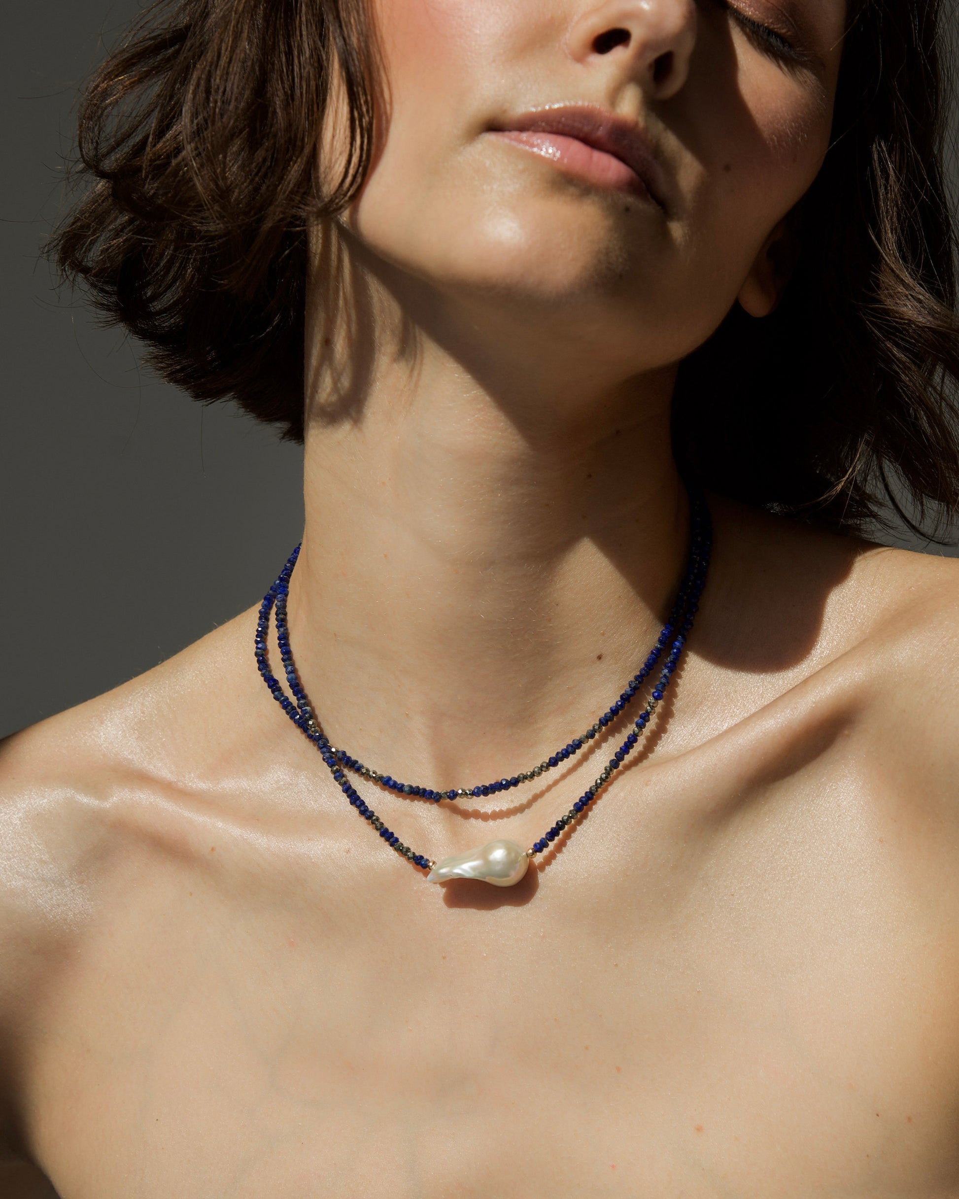 monái baroque pearl and lapis lazuli necklace styled on model – elegant, everyday statement jewelry with natural texture and rich color