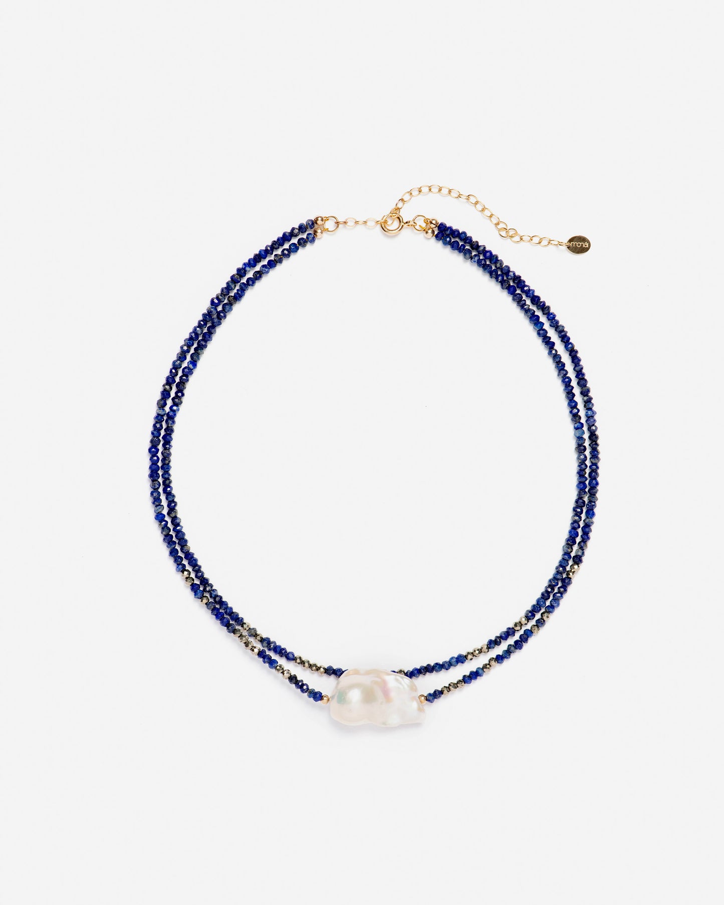 monái baroque pearl and lapis lazuli necklace laid flat – minimalist handcrafted design featuring deep blue stones and uniquely shaped pearls