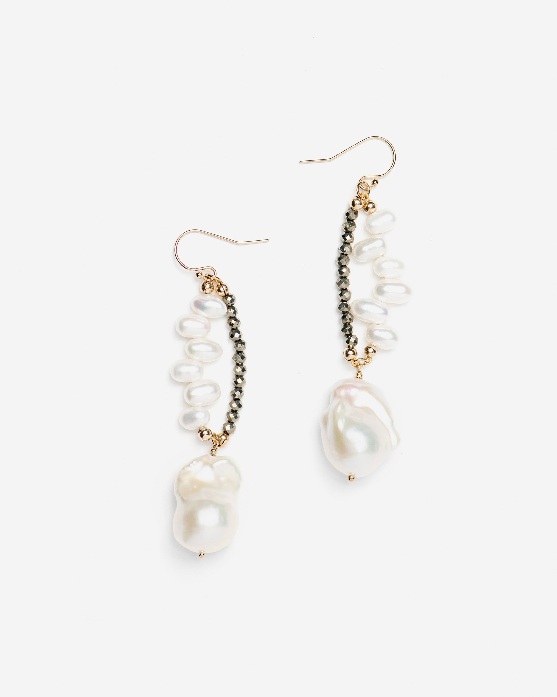 monái baroque pearl pyrite earrings laid flat – handcrafted design featuring luminous baroque pearls, faceted pyrite gemstones, and 14K gold-filled hardware