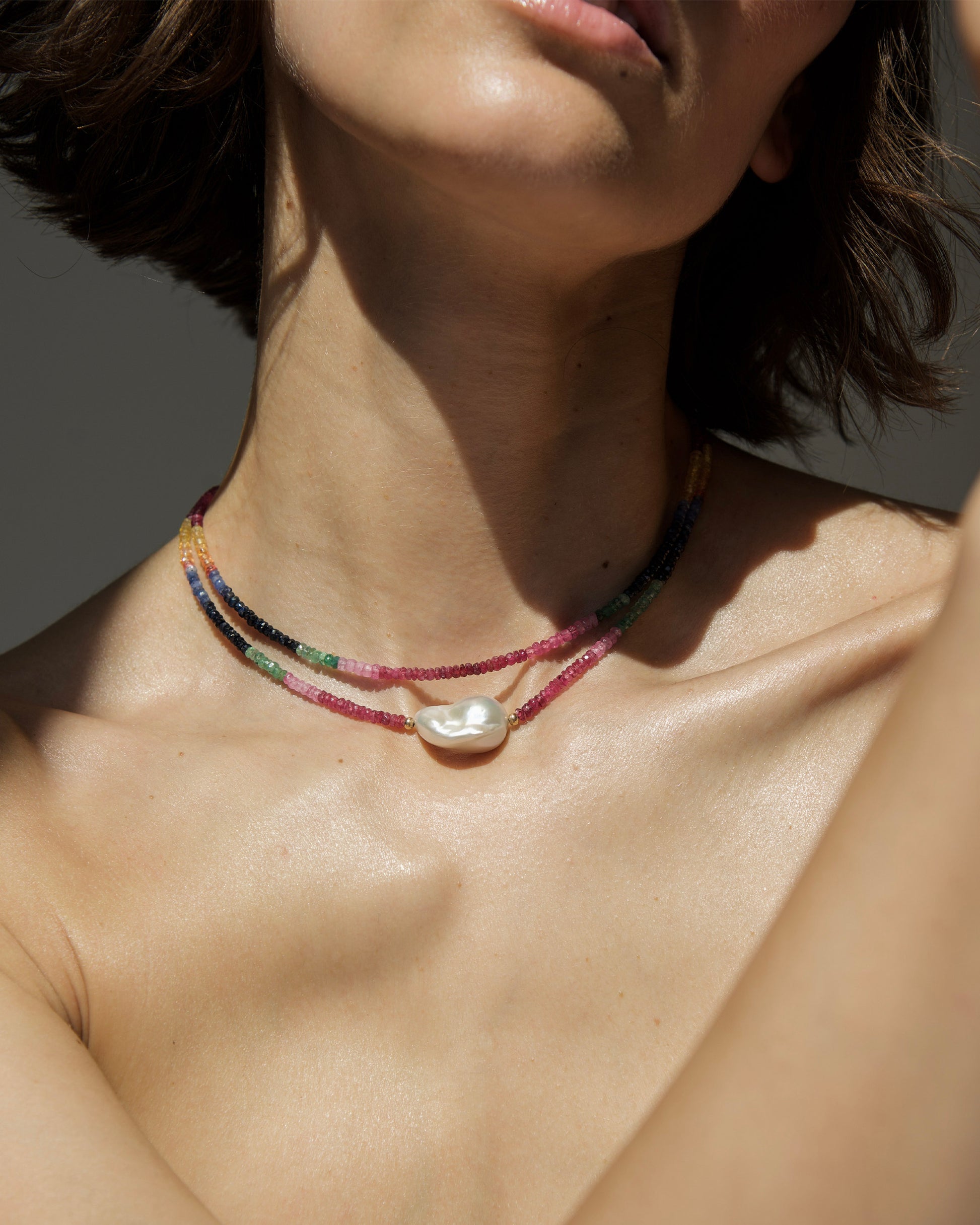 monái baroque pearl rainbow necklace worn by model – elegant layering of natural gemstones and pearls for a statement look