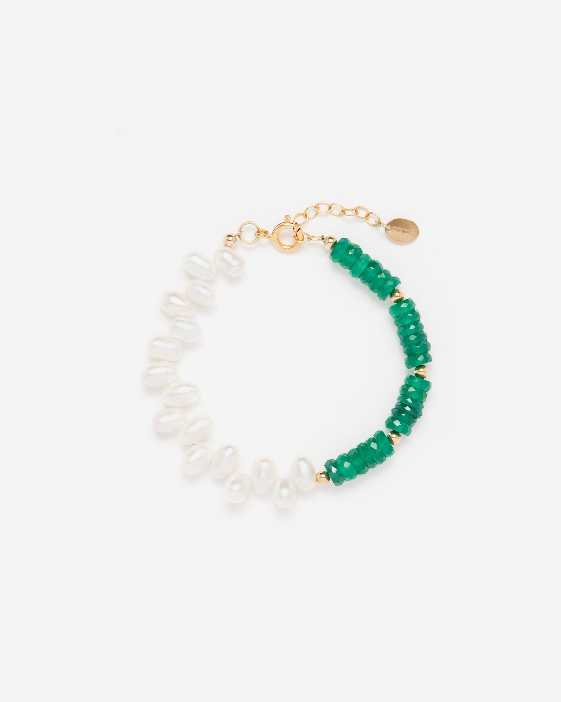 close-up of monái green onyx asymmetrical bracelet – hand-cut stones arranged in a bold, unbalanced composition with 14K gold-filled accents