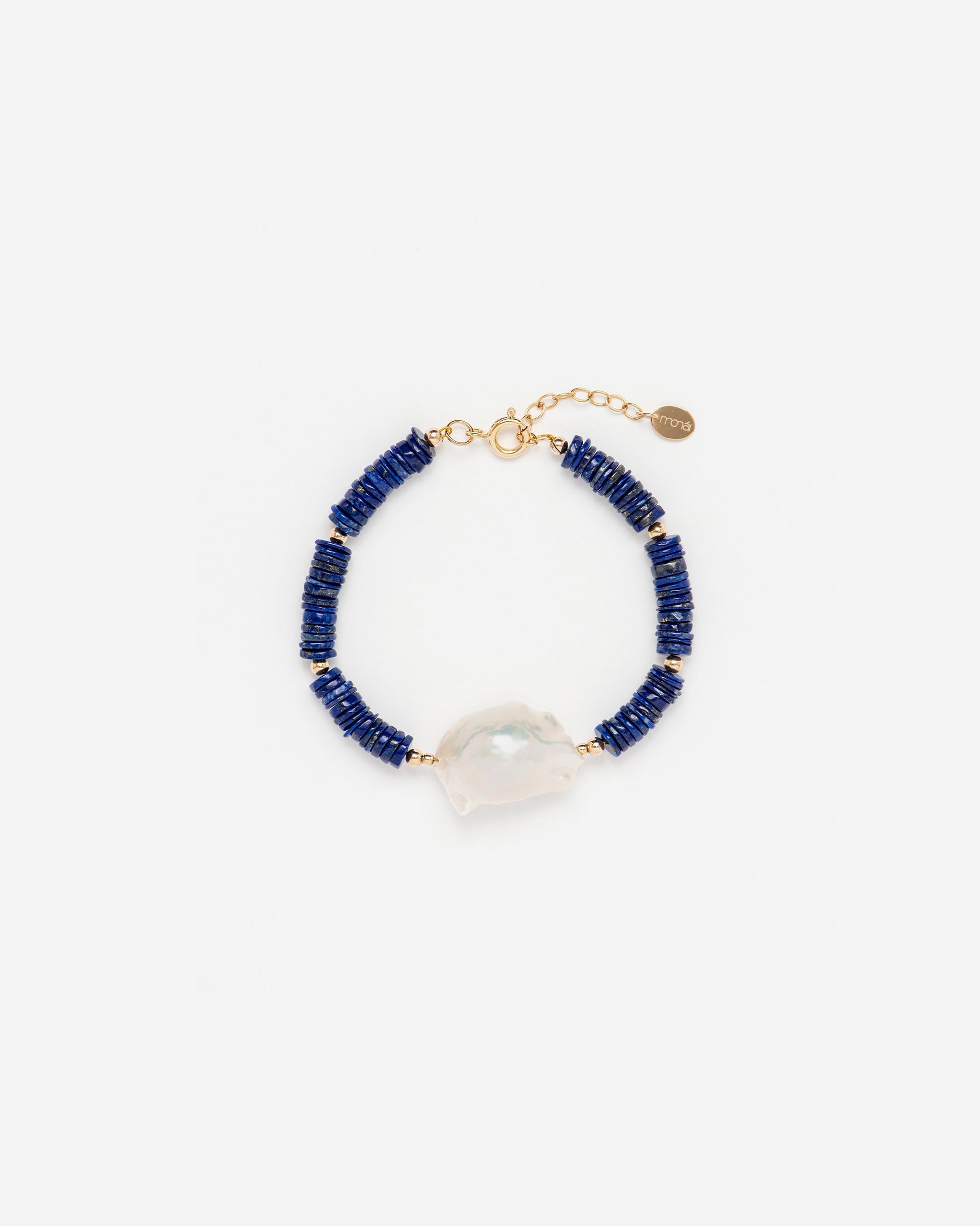 monái lapis lazuli accent pearl bracelet laid flat – handcrafted design featuring luminous baroque pearl, deep blue lapis lazuli, and 14K gold-filled hardware