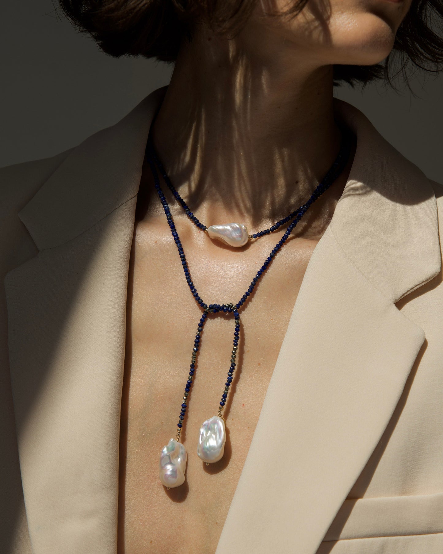 monái long baroque pearl lapis lazuli necklace styled in a loop – versatile design highlighting the interplay of natural gemstones and pearls