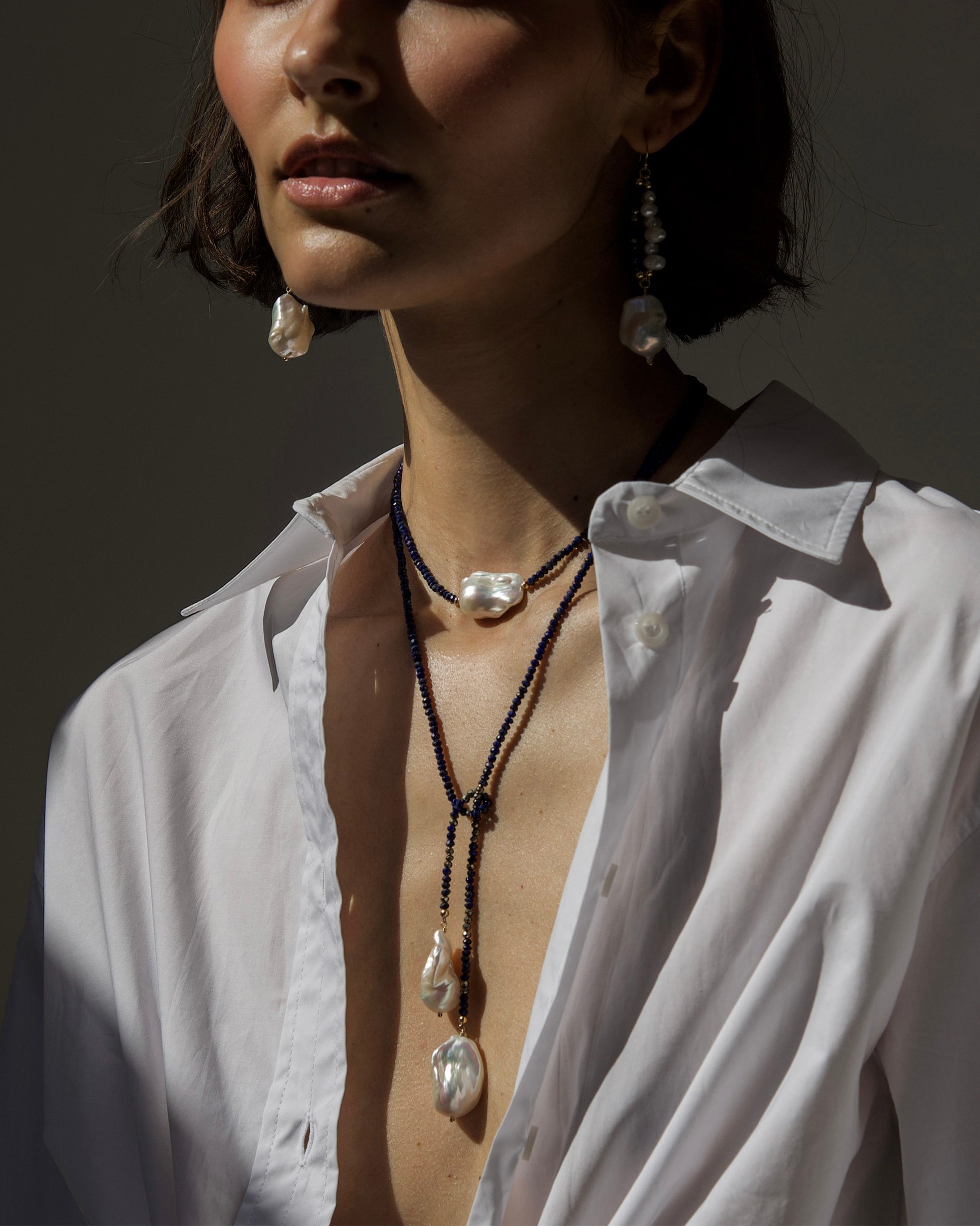 monái long baroque pearl lapis lazuli necklace layered with matching baroque pearl lapis lazuli earrings – combined styling for a dramatic, handcrafted statement