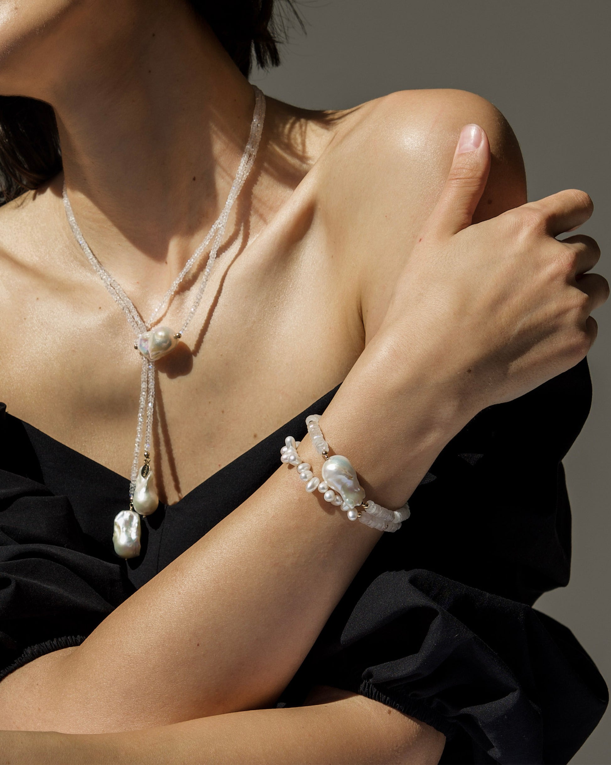monái long baroque pearl rainbow moonstone necklace fastened as a loop on model – versatile styling highlighting the interplay of natural gemstones and pearls