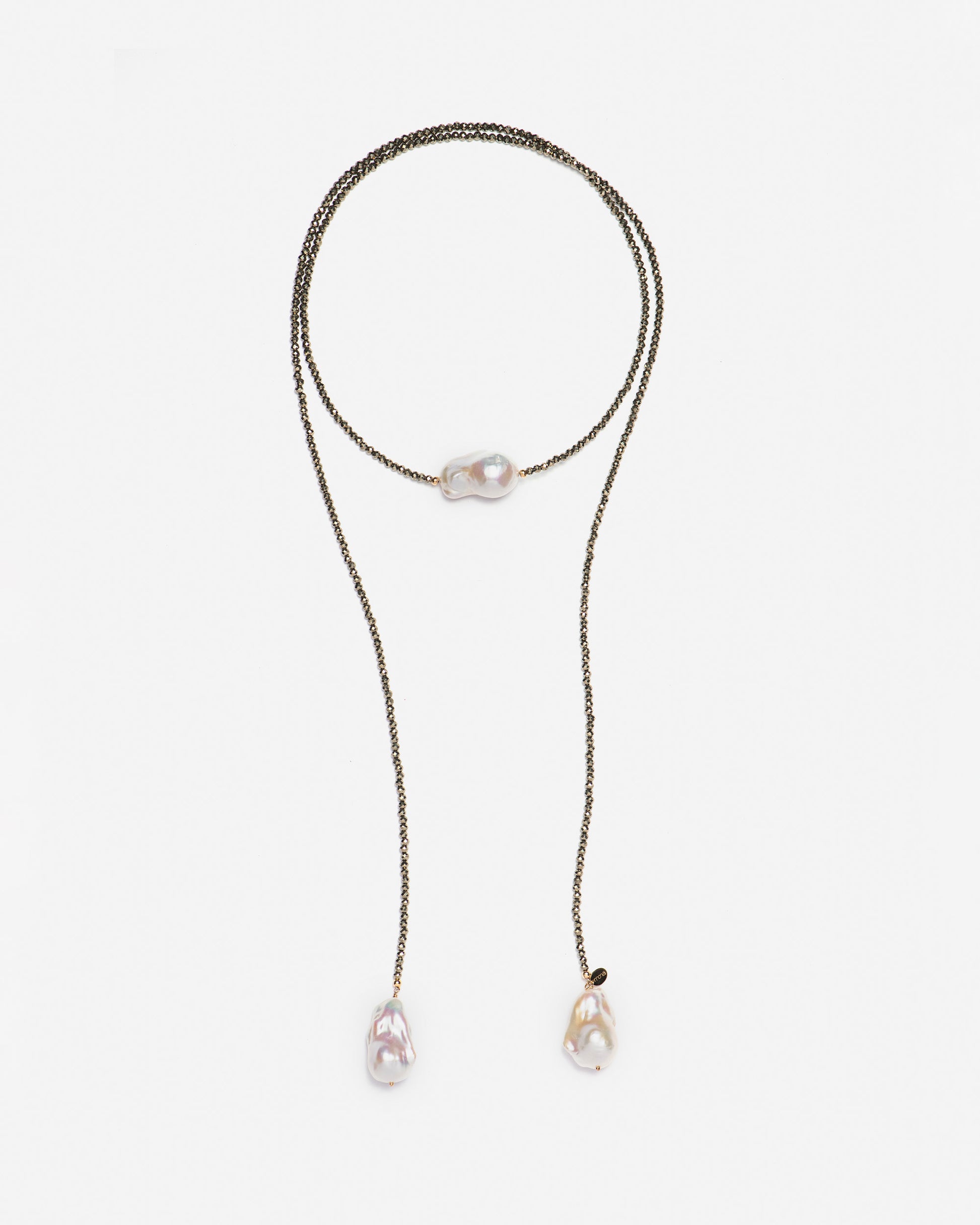 monái long baroque pearl pyrite necklace laid flat – handcrafted design featuring luminous baroque pearls, faceted pyrite gemstones, and 14K gold-filled hardware