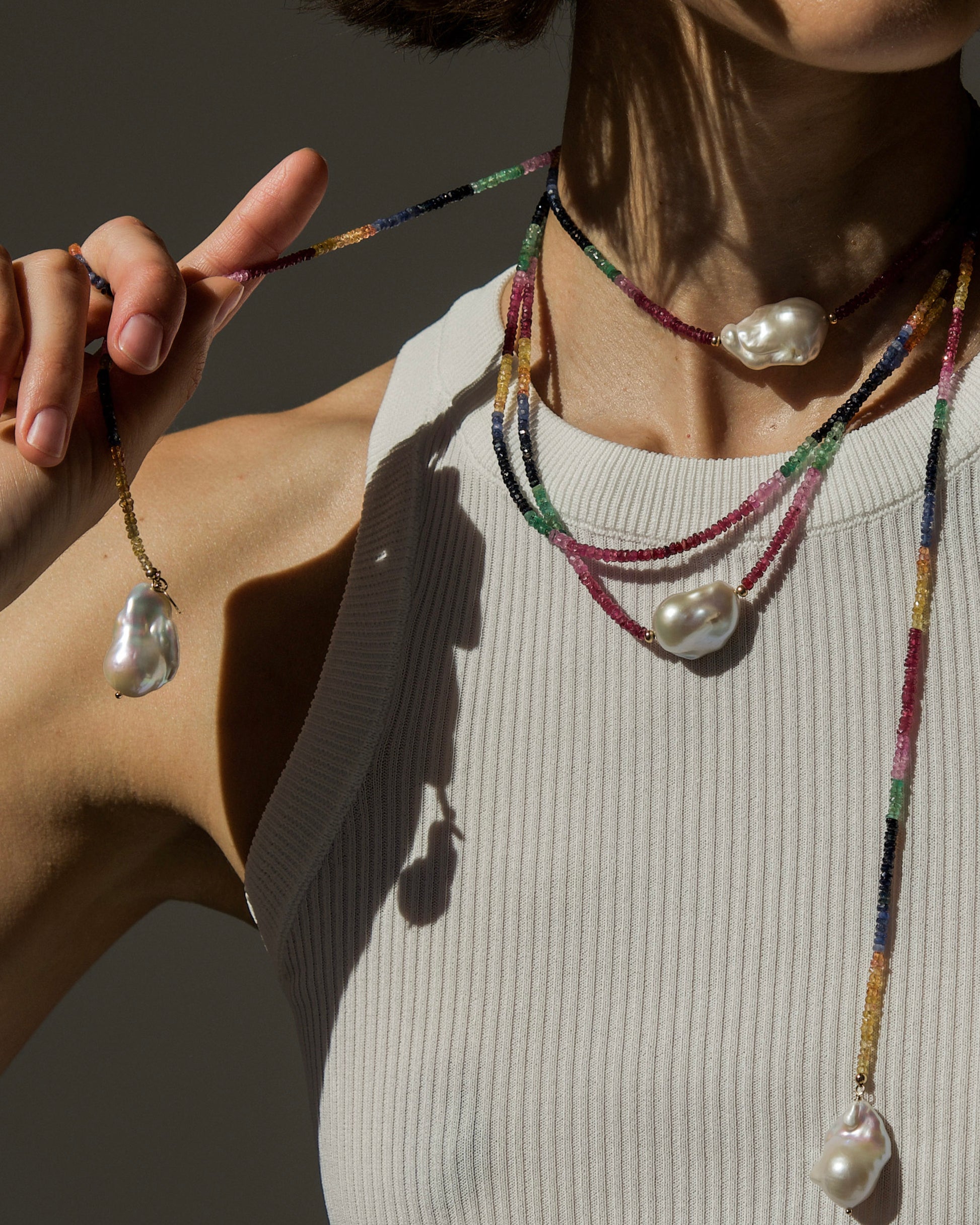 model wearing monái long baroque pearl rainbow necklace layered with baroque pearl rainbow necklace – handcrafted luxury jewelry with luminous pearls and vibrant rainbow gemstones for a bold, elegant statement