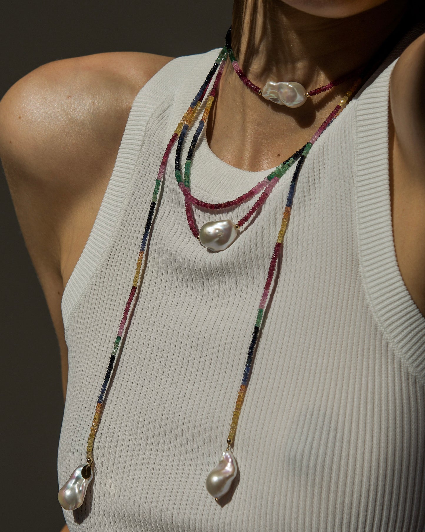 model wearing monái long baroque pearl rainbow necklace layered with baroque pearl rainbow necklace – handcrafted luxury jewelry with luminous pearls and vibrant rainbow gemstones for a bold, elegant statement