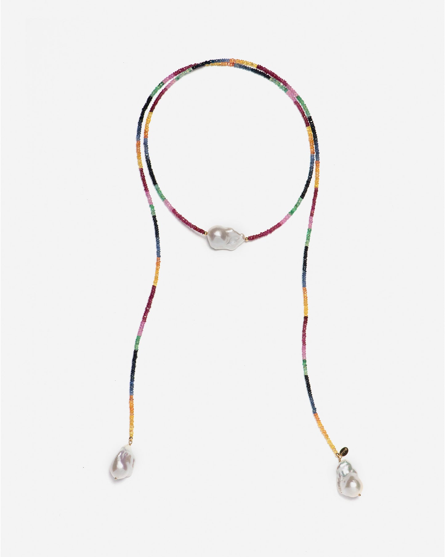 monái long baroque pearl rainbow necklace laid flat – handcrafted design featuring luminous baroque pearls, vibrant rubies, emeralds, blue and yellow sapphires, and 14K gold-filled hardware