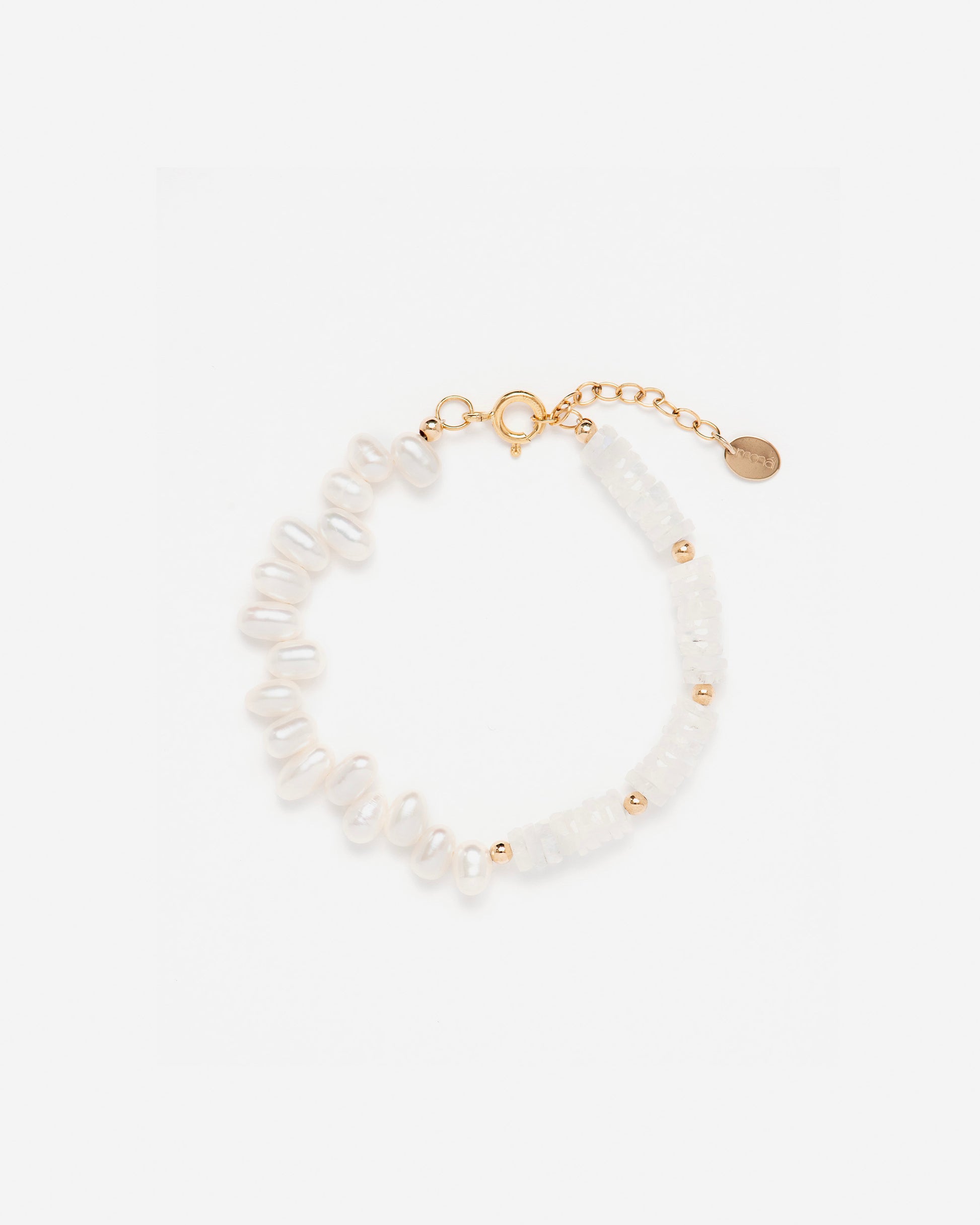 monái rainbow moonstone asymmetrical bracelet laid flat – handcrafted design featuring luminous baroque pearls, milky rainbow moonstones, and 14K gold-filled hardware