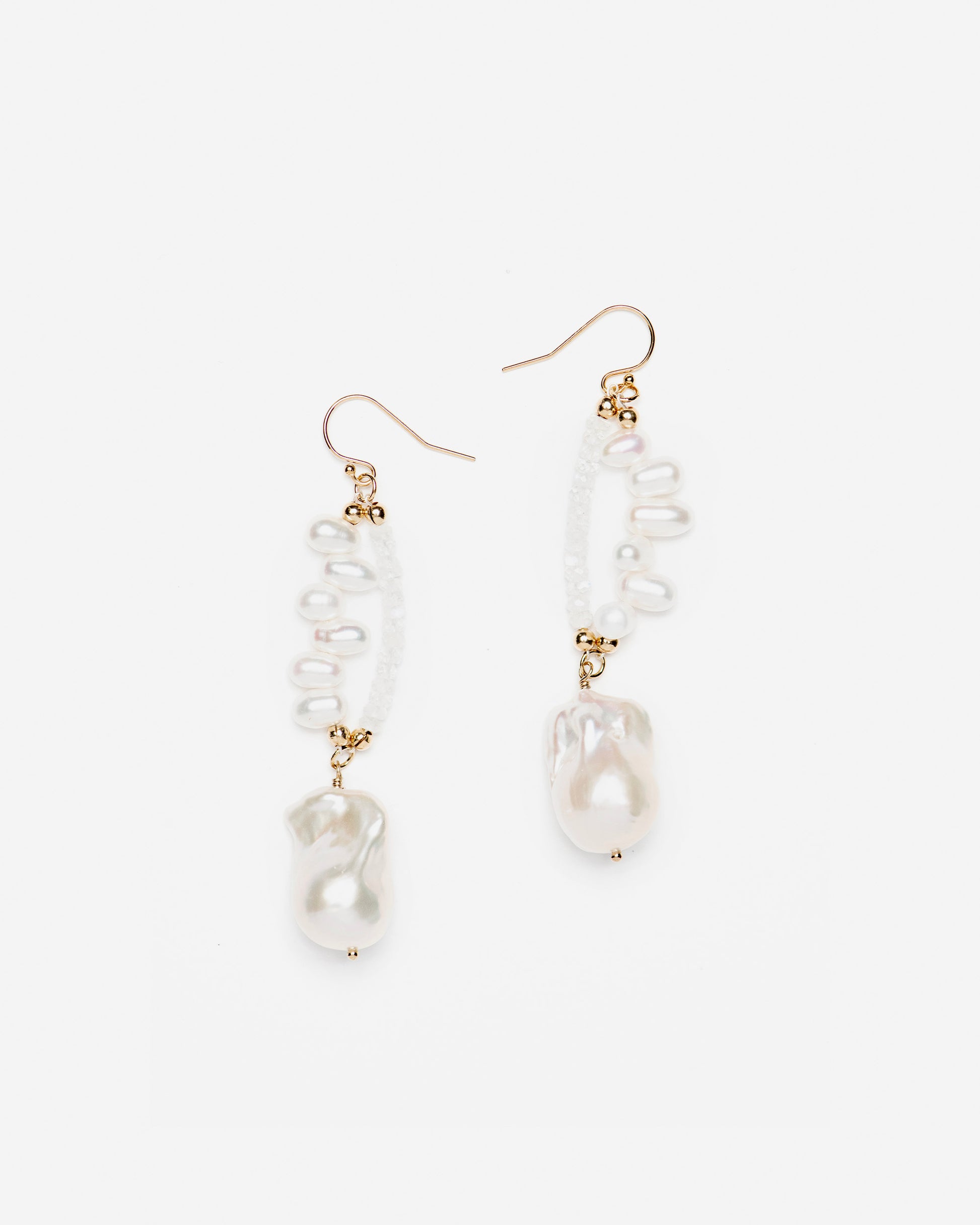 monái baroque pearl rainbow moonstone earrings laid flat – handcrafted design featuring luminous baroque pearls, milky rainbow moonstones, and 14K gold-filled hardware