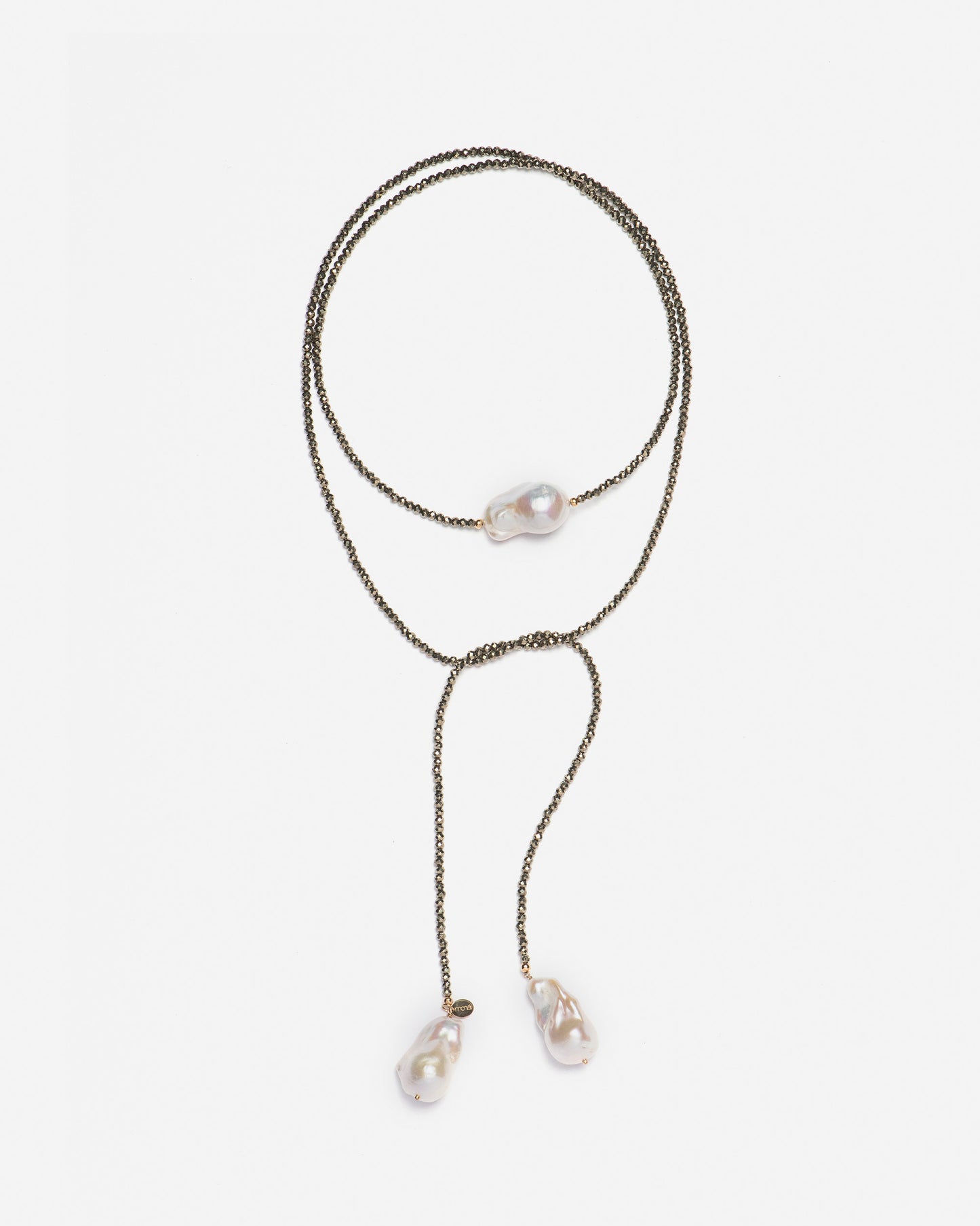 close-up of monái long baroque pearl pyrite necklace showcasing AAA+ quality baroque pearls paired with hand-cut pyrite gemstones – a harmonious blend of organic form and metallic shimmer
